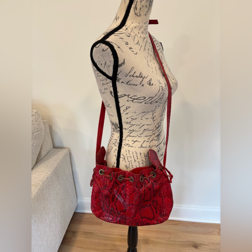 Laurent Mercadal red snakeskin drawstring bucket bag